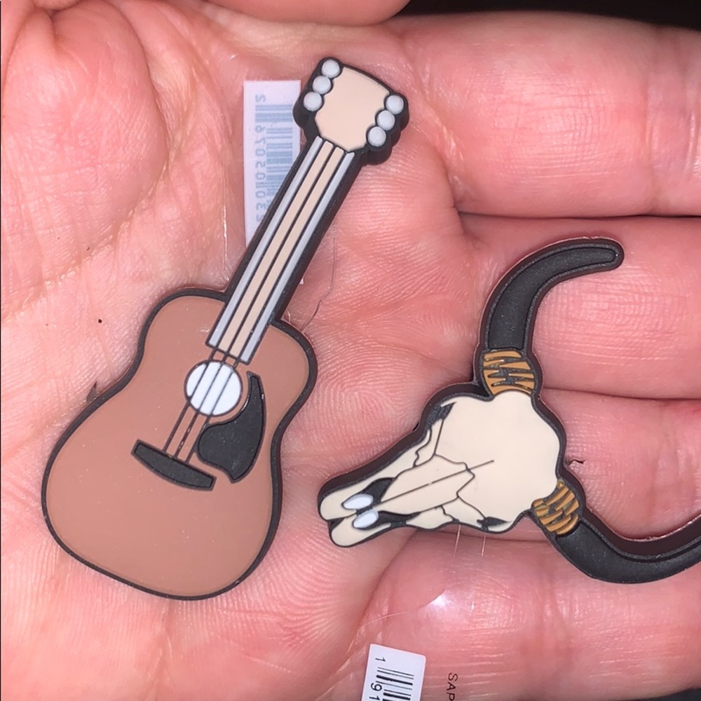 Guitar and Longhorn jibbitz.